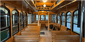 Electric green trolley on city street