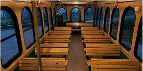 Side-by-side of trolley and shuttle bus